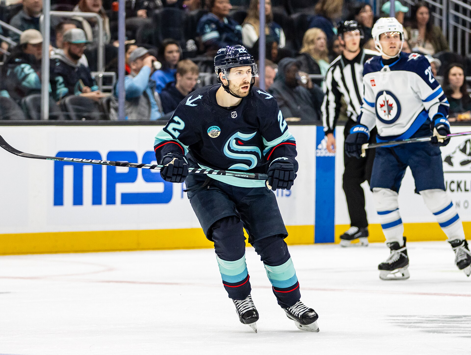 Winnipeg Jets and Seattle Kraken players during an NHL game in Seattle in March 2024